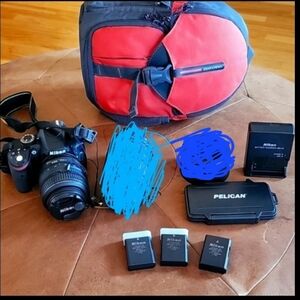 Nikon D3200 camera and 18-55 wide angle lense, and other extras